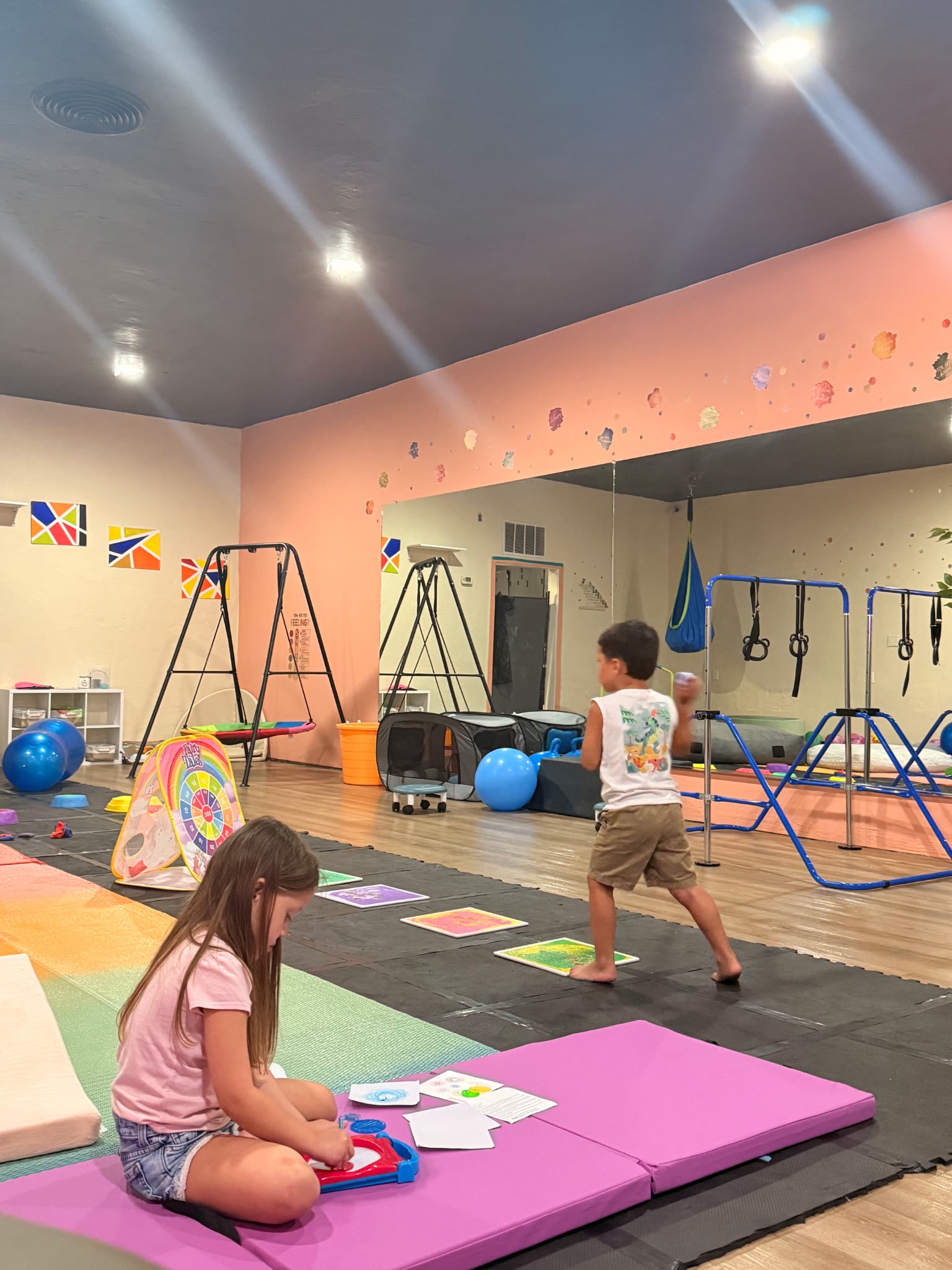 Children playing in an indoor gymnasium